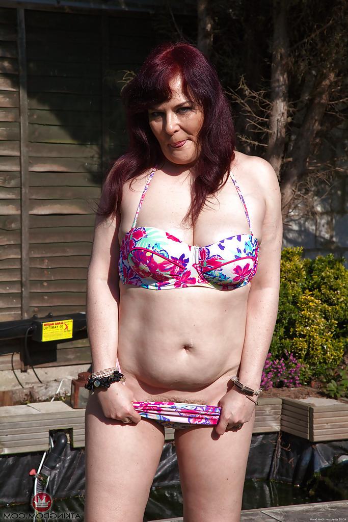 16P Older fatty Christina X pulling down bikini bottoms outdoors