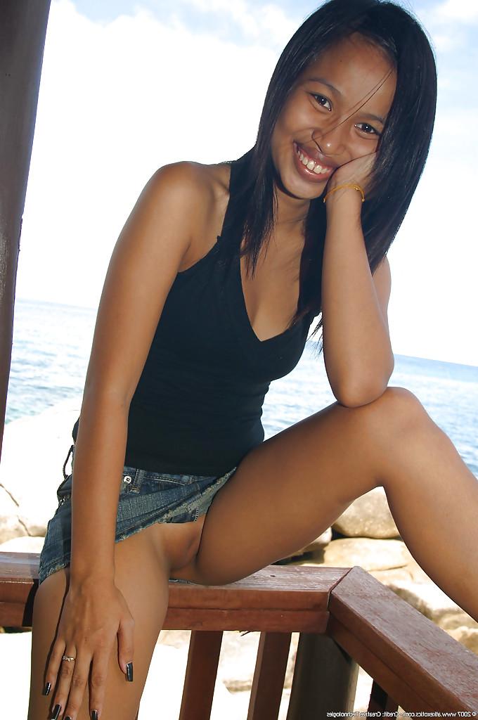 16P Asian amateur Lily exposing shaved vagina outdoors after upskirt