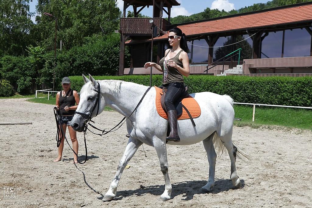 16P Pornstar Aletta Ocean is riding a horse outdoor in glasses