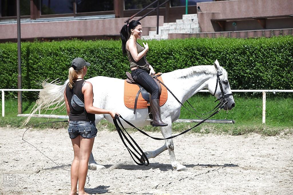 16P Pornstar Aletta Ocean is riding a horse outdoor in glasses