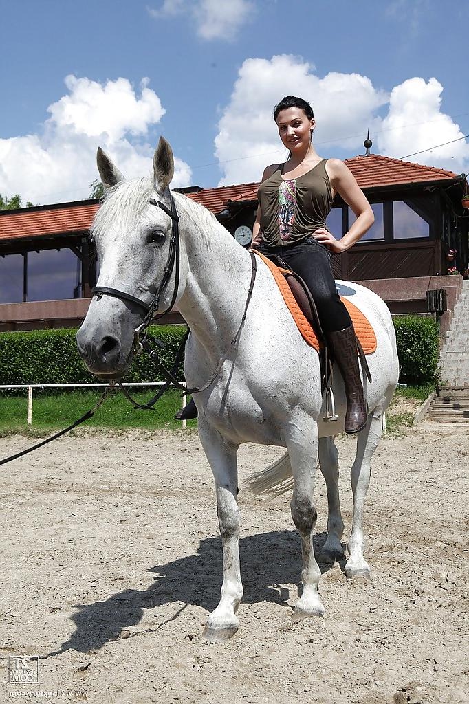16P Pornstar Aletta Ocean is riding a horse outdoor in glasses