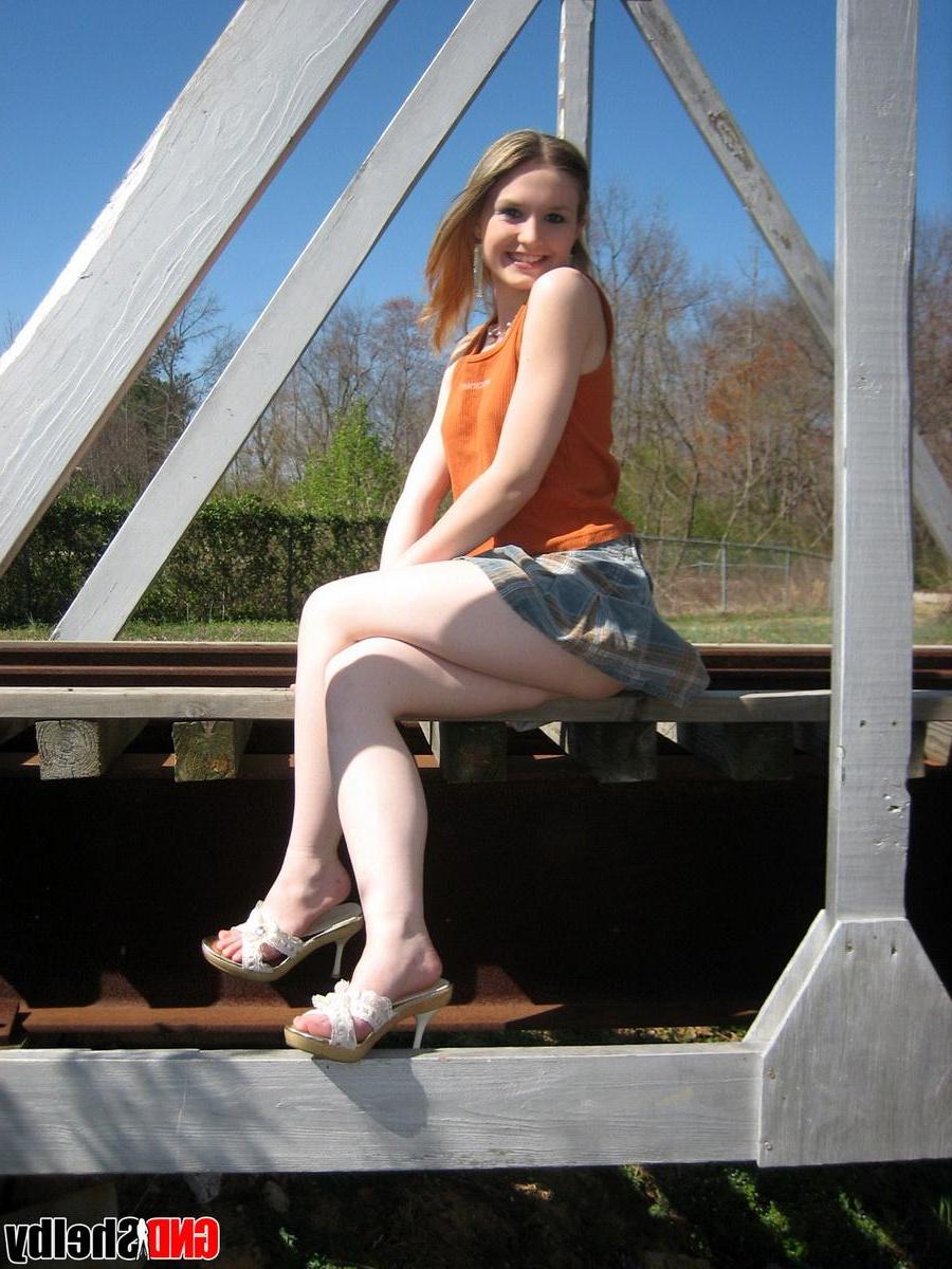 12P Cute petite teen Shelby flashes her perky tits outdoors at the public park