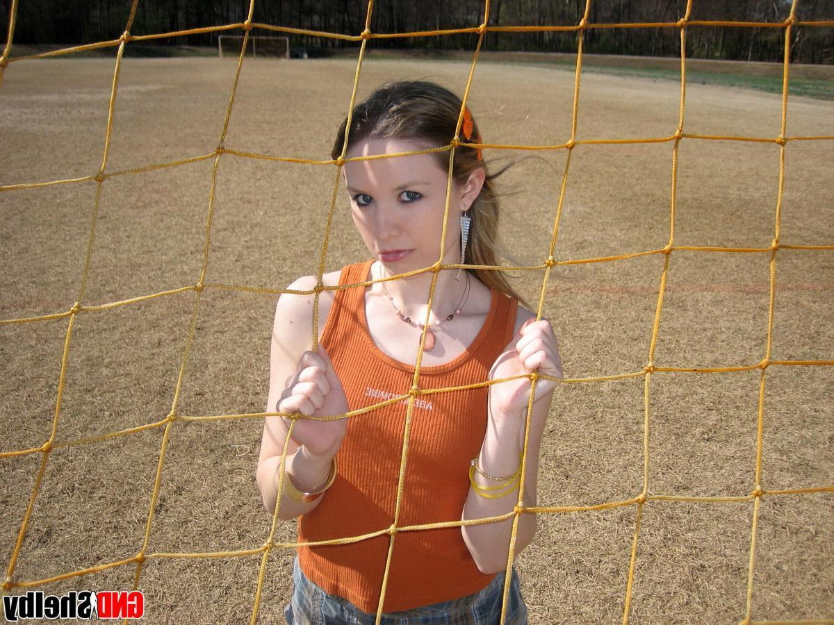 12P Cute petite teen Shelby flashes her perky tits outdoors at the public park