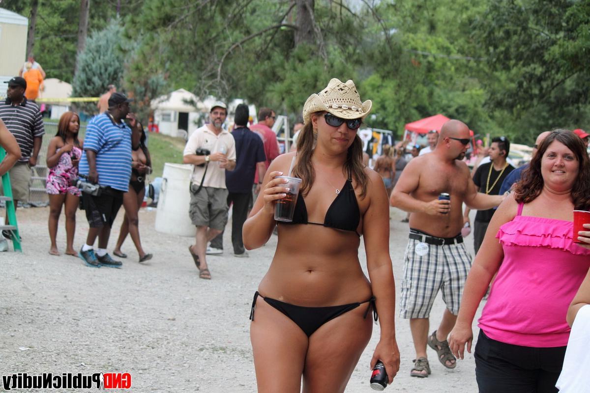 12P Naked strippers show off their abilities on the pool at an outdoor public nudity party