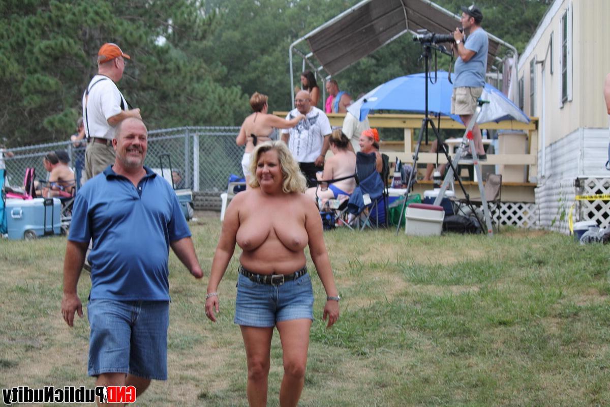 12P Naked strippers show off their abilities on the pool at an outdoor public nudity party