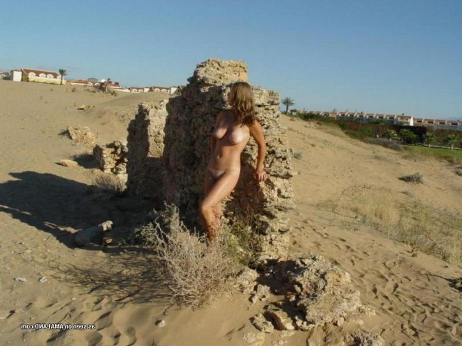 12P Collection of a sexy wild honey posing naked outdoors