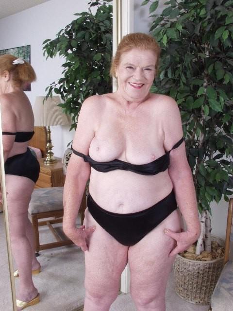 14P granny showing off her aged bum