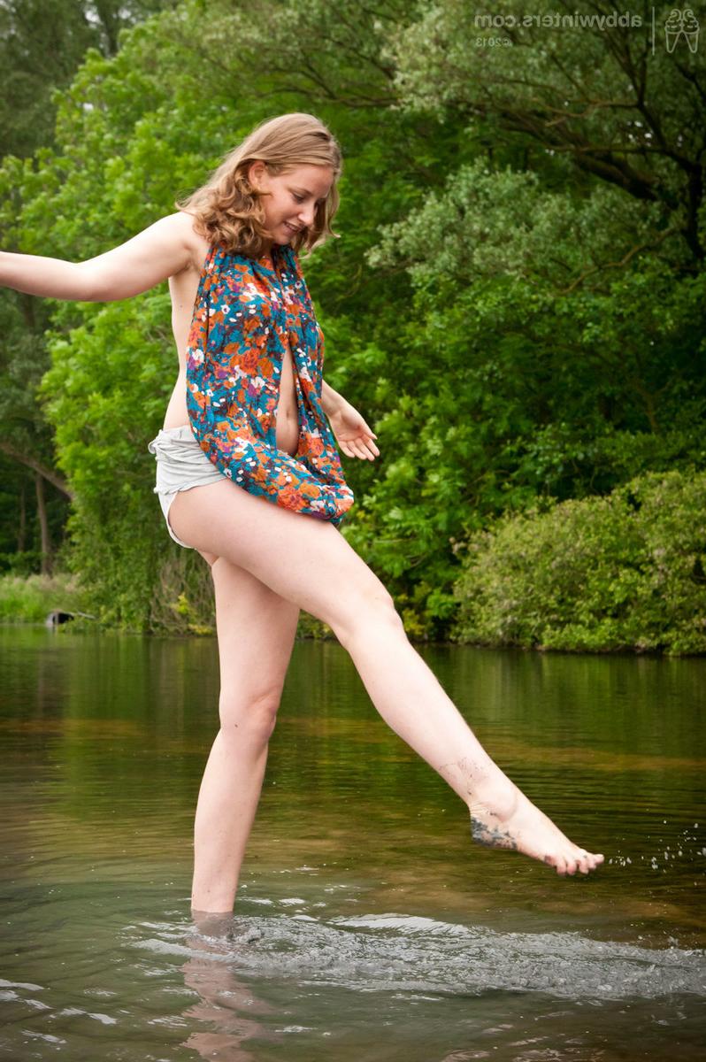 15P Curvy and natural redhead showing her unshaved hairy pussy outdoors