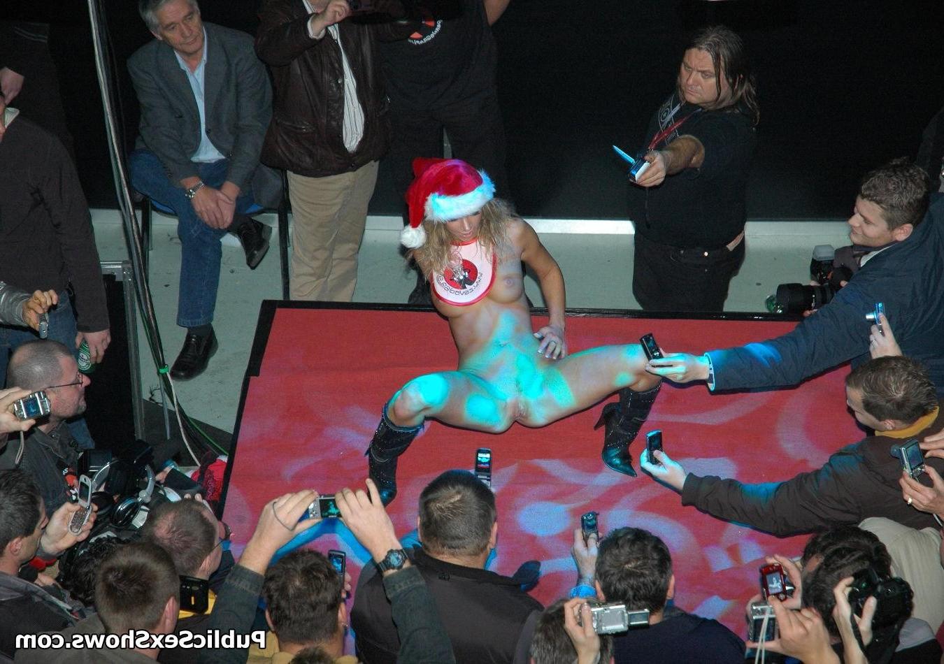 12P Adorable blonde girl stripping off the santa coat on the stage
