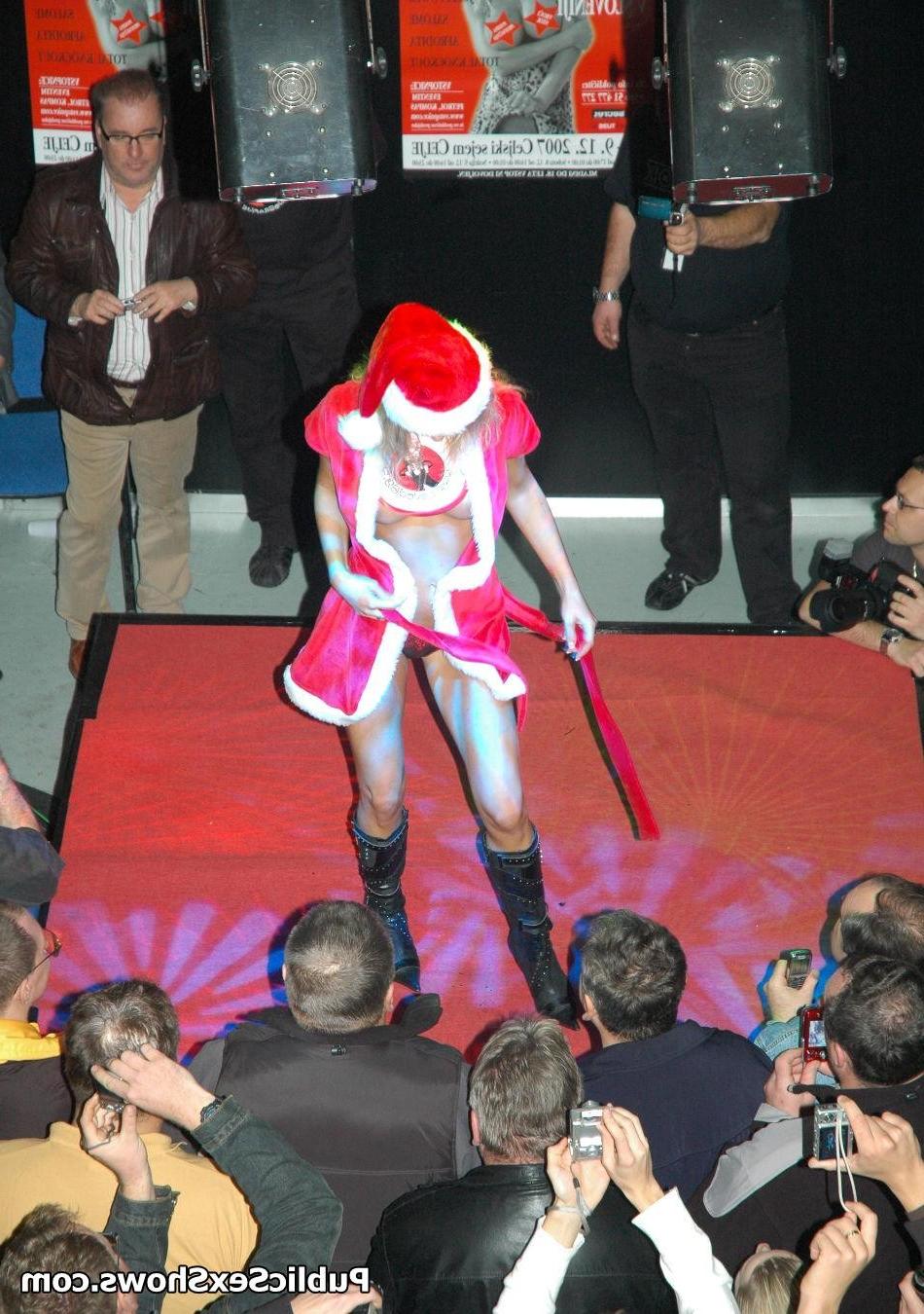 12P Adorable blonde girl stripping off the santa coat on the stage