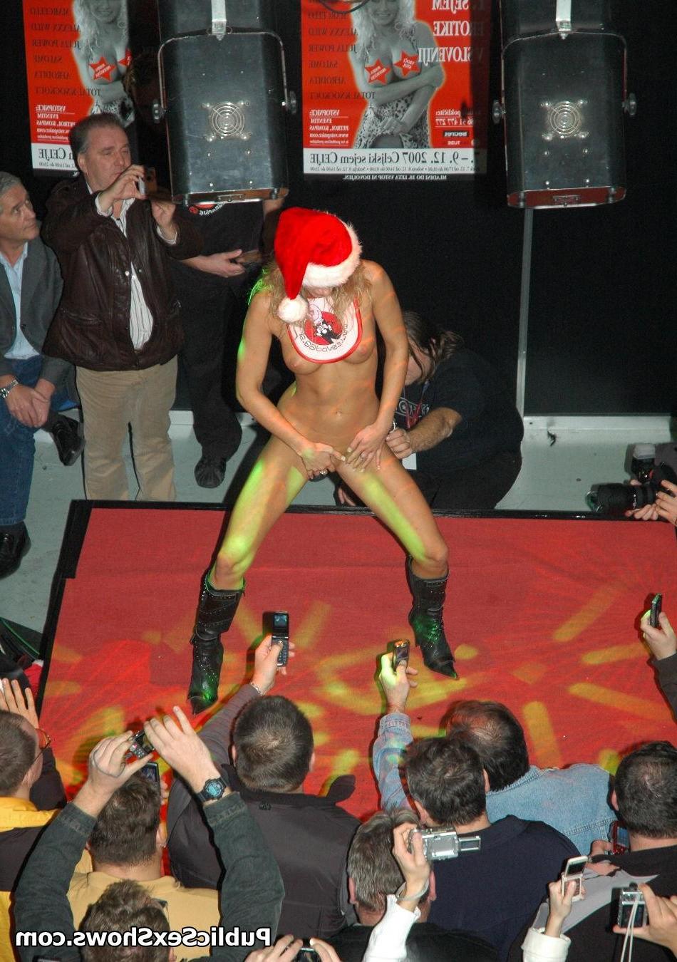 12P Adorable blonde girl stripping off the santa coat on the stage