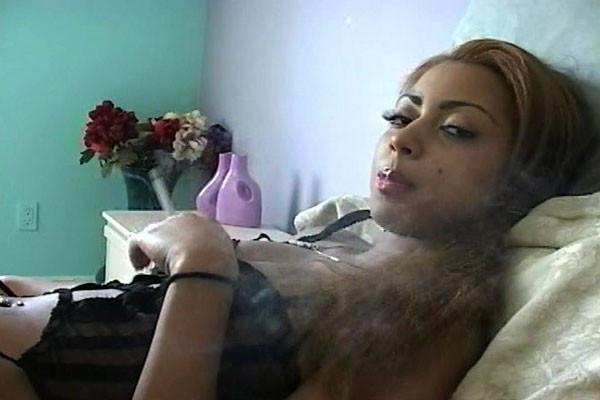 15P An African- American cutie flaunts her sexy bod while enjoying puffs of a cigare