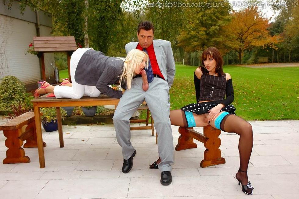 16P Two ladies in stockings sharing cock outdoors