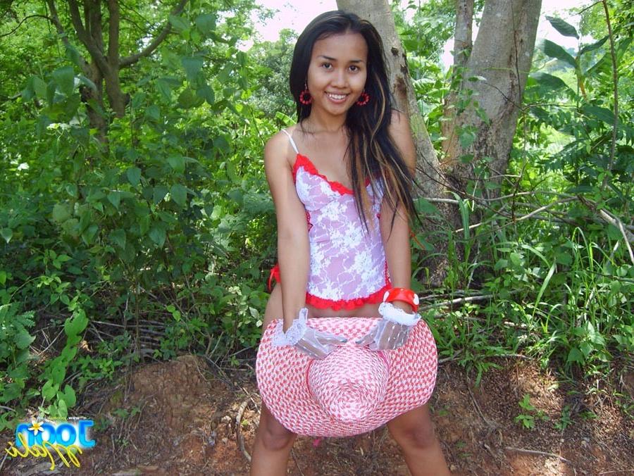 16P Thai girl in lingerie and hat outdoors