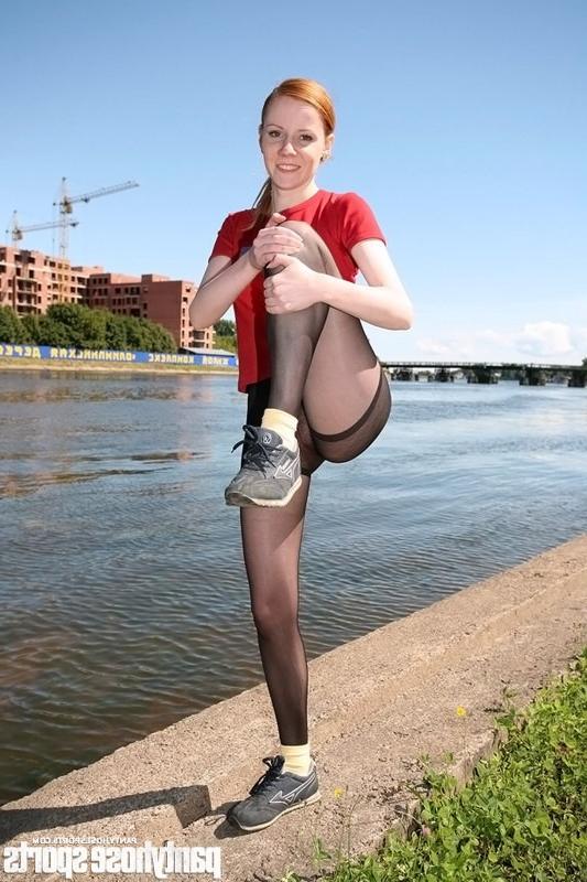 15P Redheaded Nimfa in pantyhose doing aerobics by the riverside