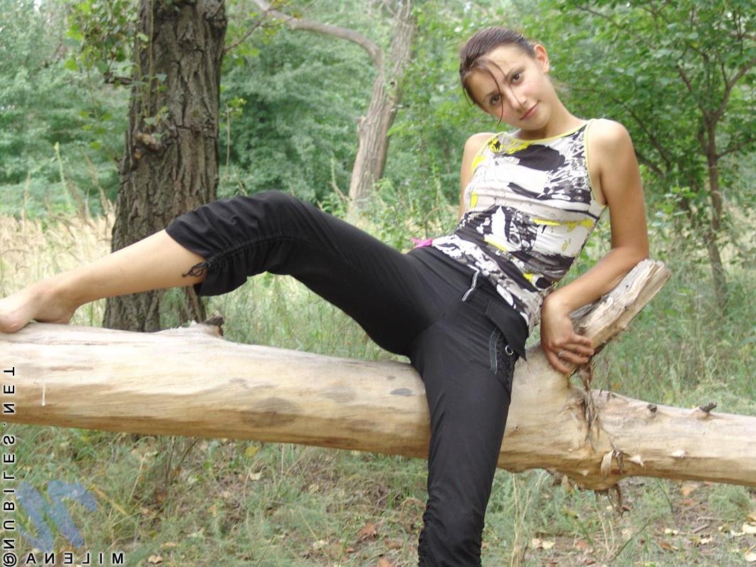 18P Petite teen with tiny titties poses nude outdoors
