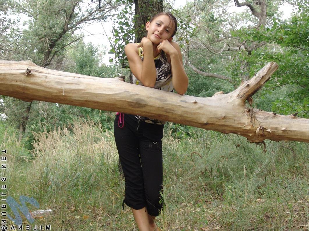 18P Petite teen with tiny titties poses nude outdoors