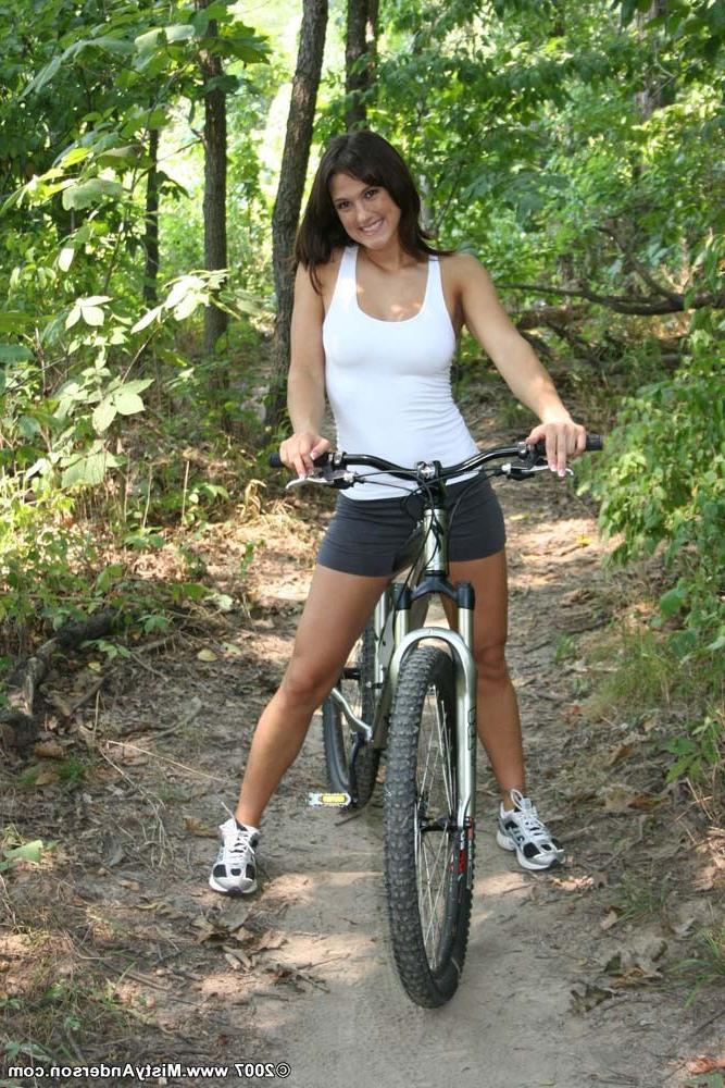 20P Nude girl bicycling outdoors
