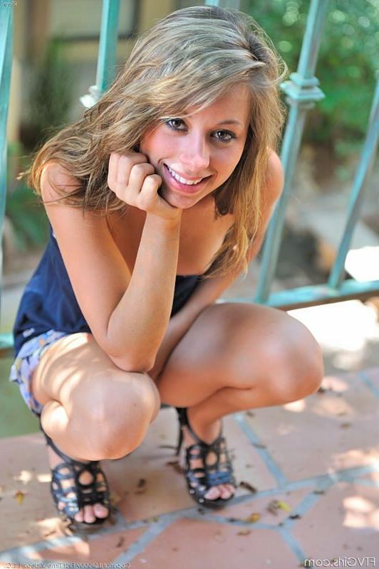 15P Beautiful teen flashes her small tits at outdoor resort