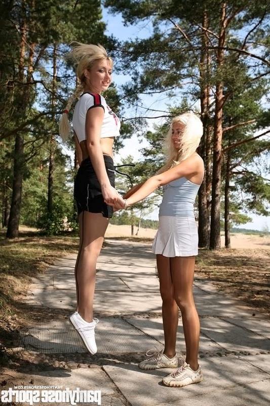 15P Two blonde girls in pantyhose doing aerobics outdoors