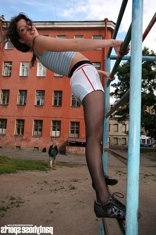 12P Tall pantyhose gymnast exercises in the open air