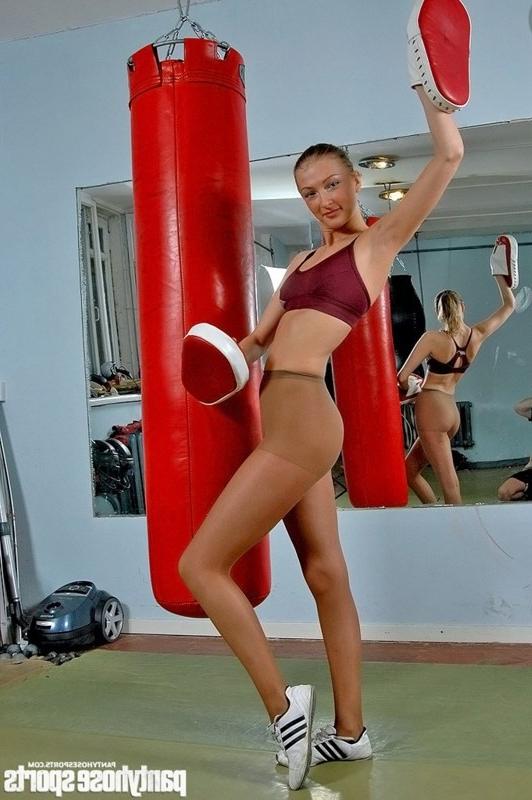 12P Gym tall girl practices boxing in pantyhose