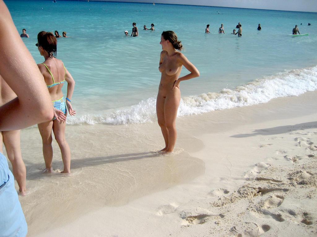15P Bouncy breasted nudist babe strips and bares all