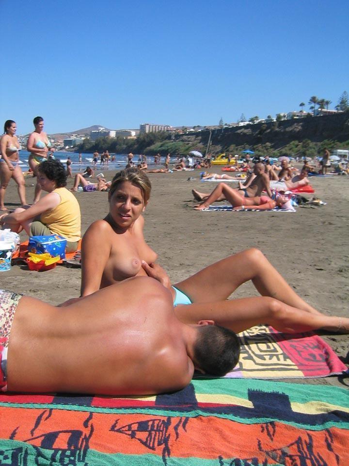 15P Dark haired nudist beach teen gets an all over tan