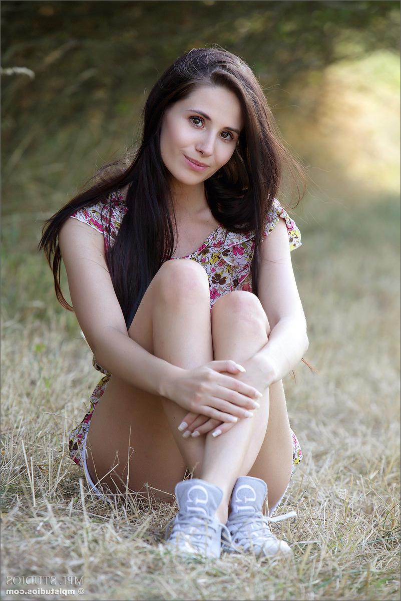 12P Luscious teen Vanessa peeling off her clothes outdoors
