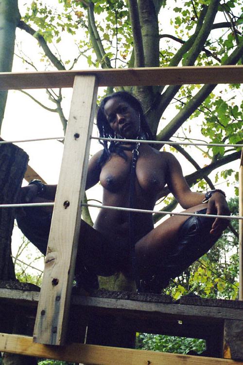 16P Ebony Cookie in outdoor public nudity and kinky strip in an english park