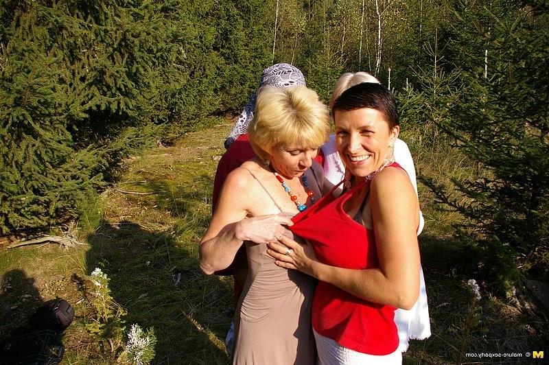 15P Naughty matures sucking and fucking in outdoor orgy