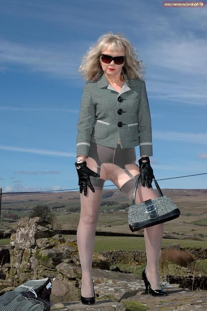 12P Leggy nylon Sue in grey stockings outdoors