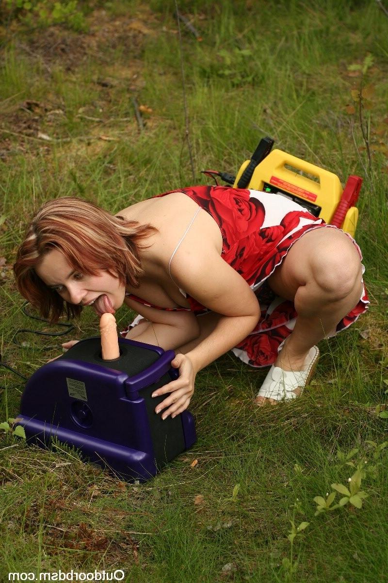 20P Sexy girl enjoying a fuck machine outdoors.