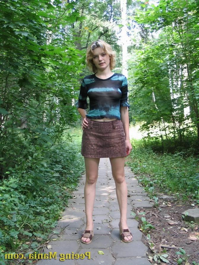 15P Blonde gal not only pees outdoors but also shows off her nude boobs