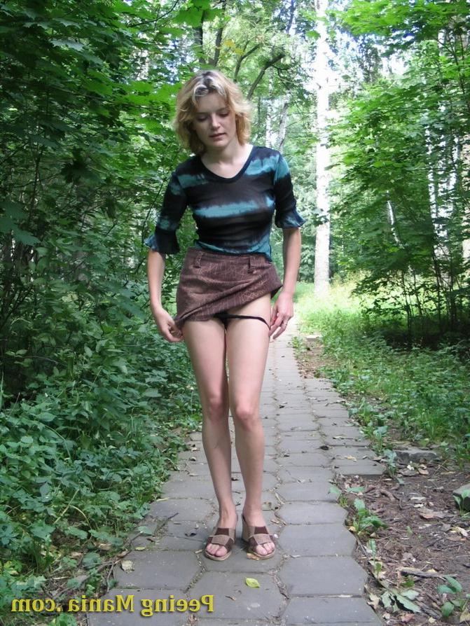 15P Blonde gal not only pees outdoors but also shows off her nude boobs