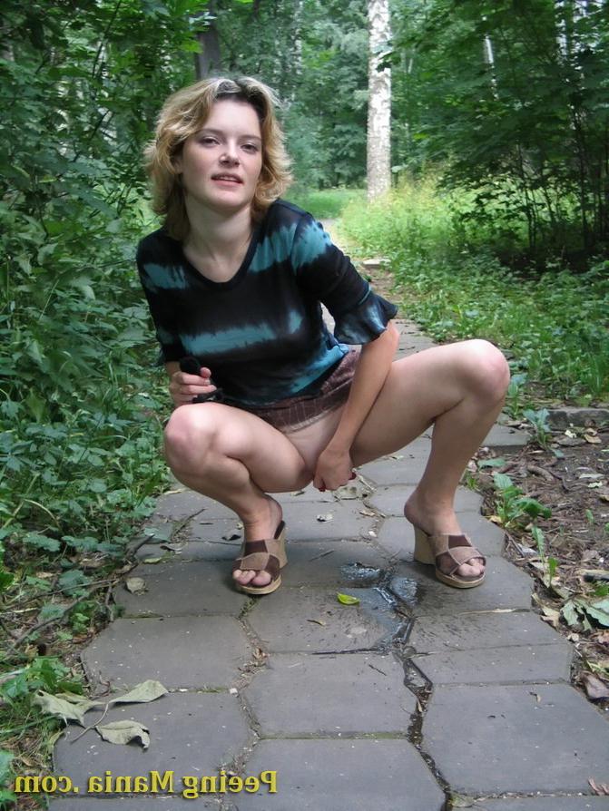 15P Blonde gal not only pees outdoors but also shows off her nude boobs