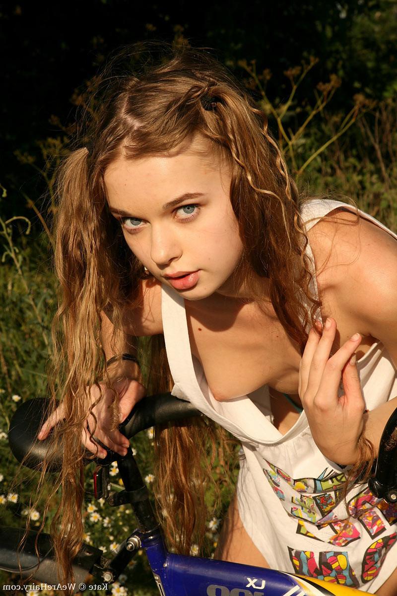 16P Hairy petite teen on a bike spreads her furry pussy outdoors