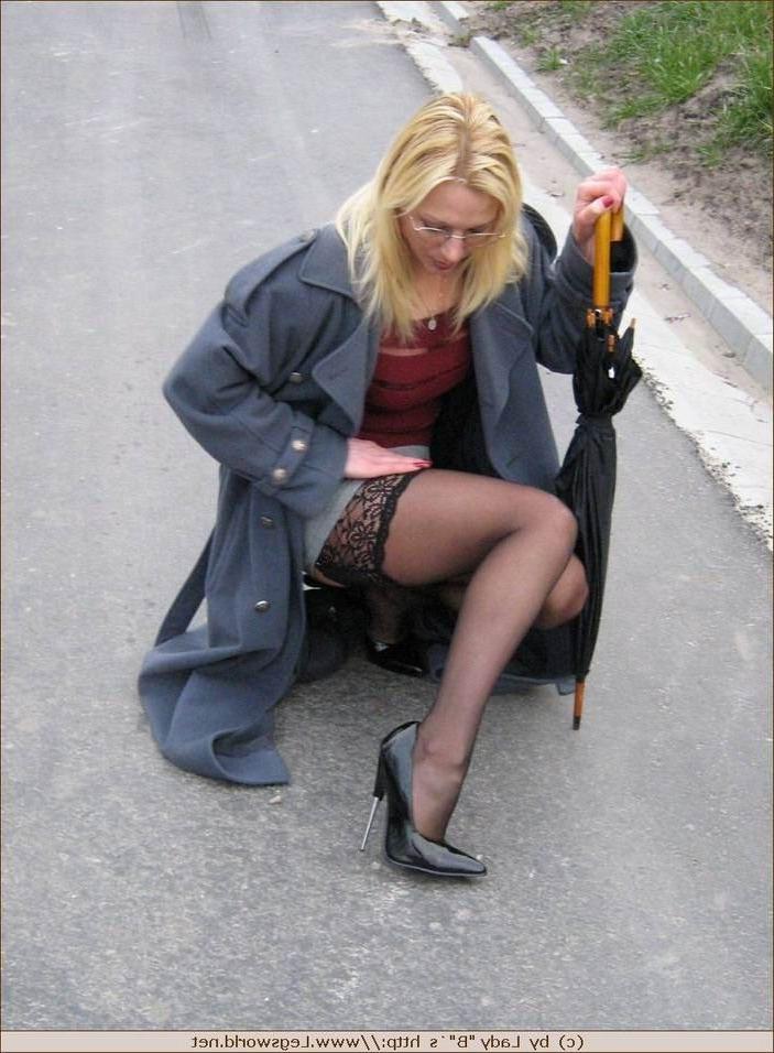 12P Leggy german amateur in stockings poses outdoors