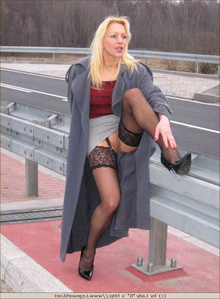 12P Leggy german amateur in stockings poses outdoors