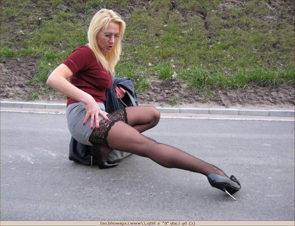 12P Leggy german amateur in stockings poses outdoors