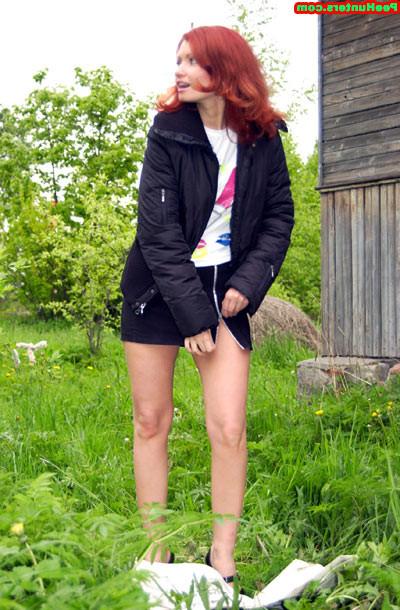 15P Sweet redhead beauty peeing on newspaper outdoors