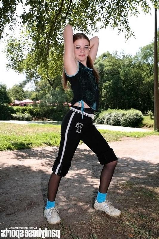 12P Redhead Babette doing pantyhose aerobics outdoors