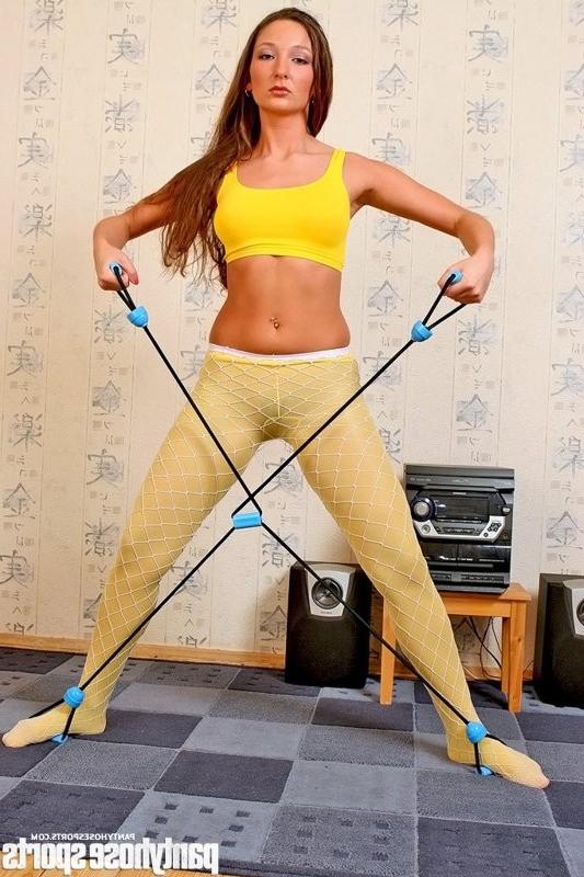 12P Maria in yellow pantyhose working out with stretching expander