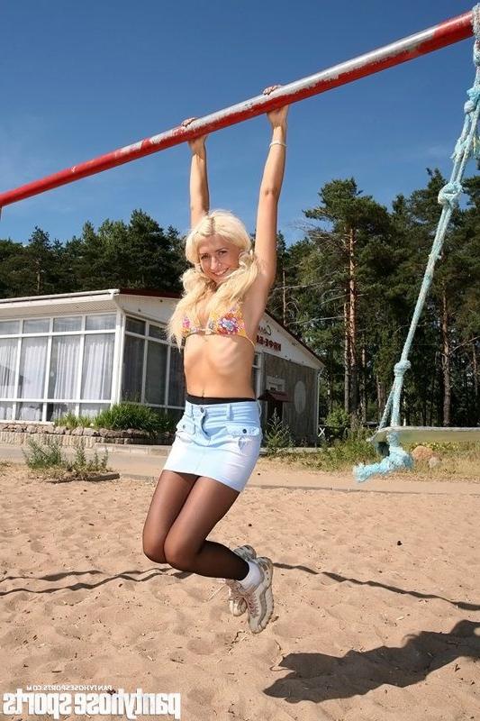 12P Blonde Anastasia in pantyhose doing exercises outdoors