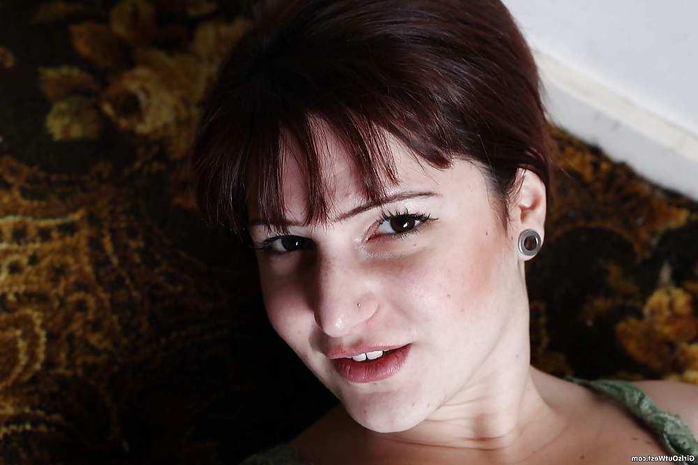 15P Busty amateur spreads her hairy pussy