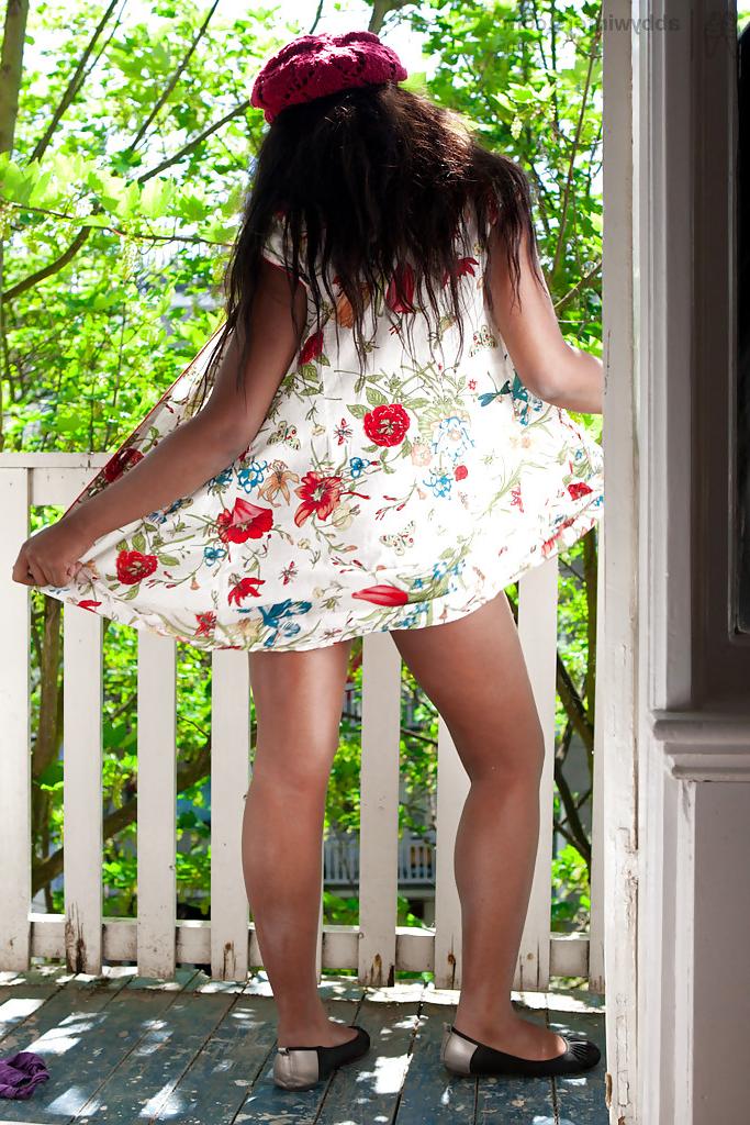 16P Buxom black babe Anouk showing off her big black booty outdoors