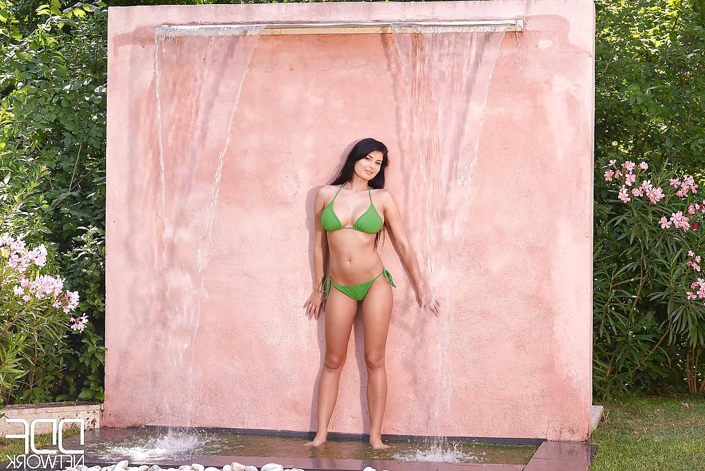 16P Big boobed babe Lucy Ly posing topless outdoors under waterfall
