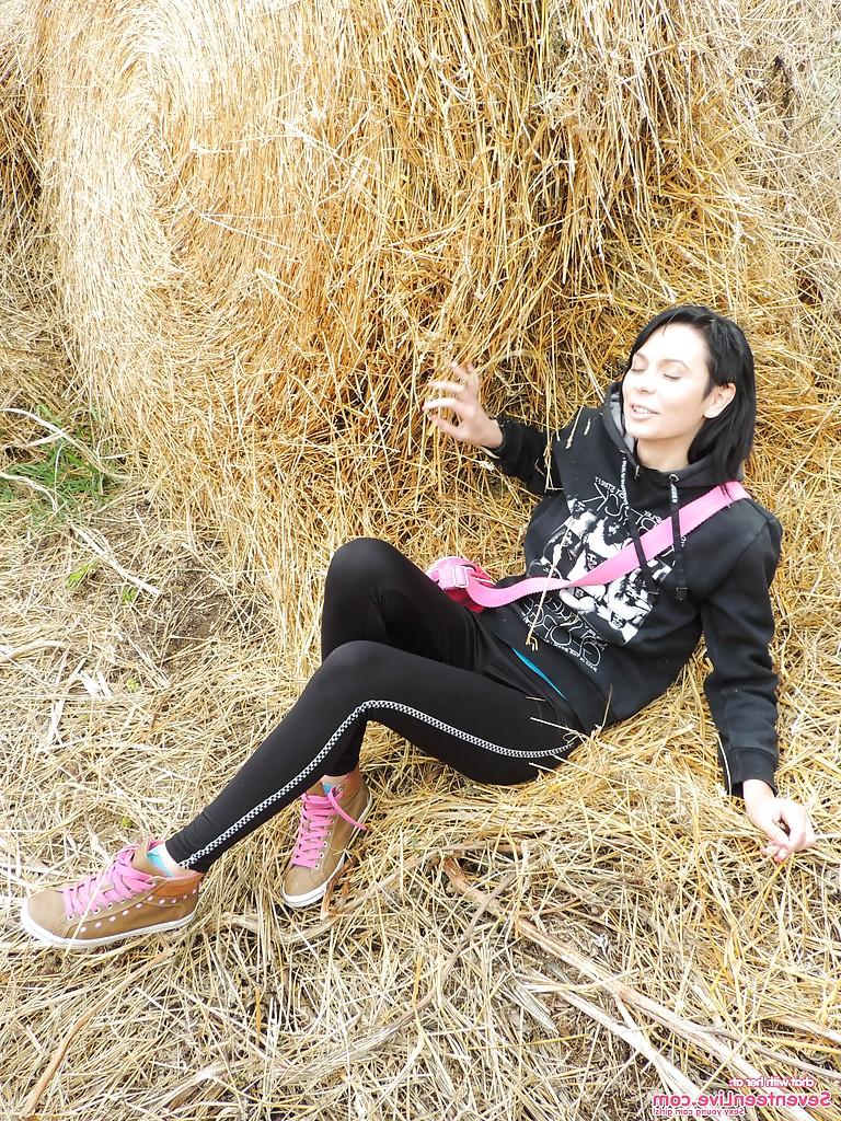 16P Naughty brunette teen lowering her pants and toying her gash outdoor