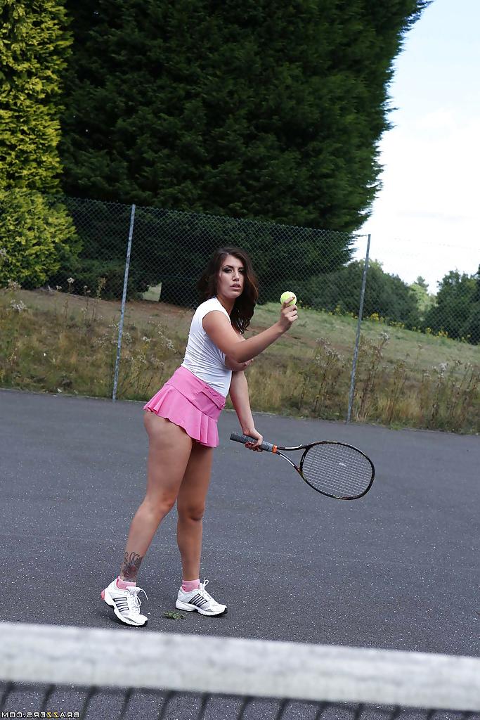 16P Tatttooed sporty babe revealing her big tits and fingering her gash outdoor