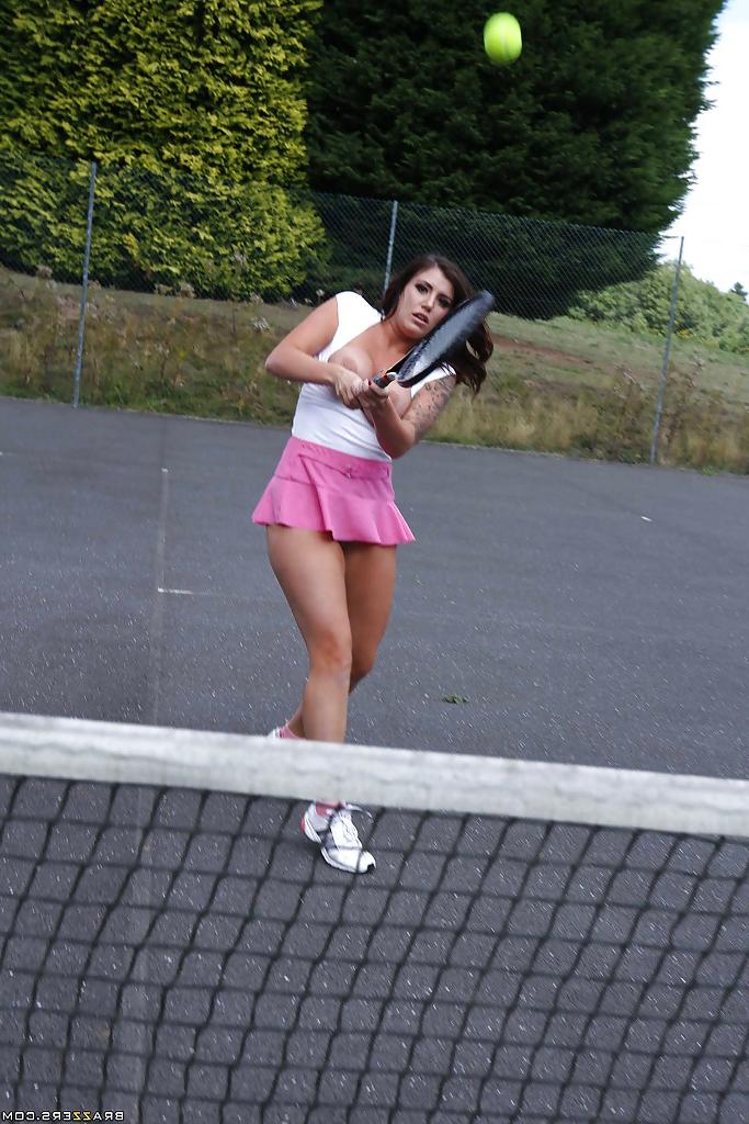 16P Tatttooed sporty babe revealing her big tits and fingering her gash outdoor